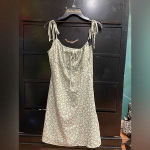 green floral dress with adjustable straps and side zipper